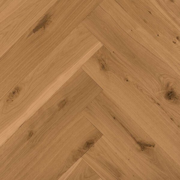 Zbliżenie drewnianej podłogi ze wzorem w jodełkę w kolorze Super Rustik.